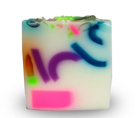 Square smooth glycerin soap bar, milky white background with multicolored swirls. Sweet pea scent. 