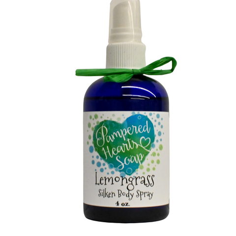 A 4 ounce blue bottle with green ribbon and white spray cap. Contains Lemongrass scented body spray. Label reflects Pampered Hearts Soap logo and product name.