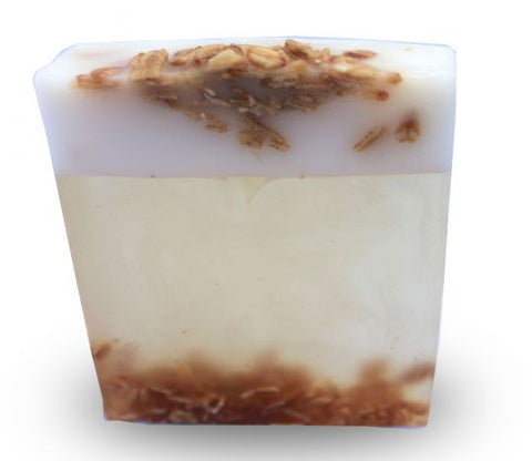 Square smooth glycerin soap bar, milky background with brown and white swirls. Oatmeal, milk and honey scent. 
