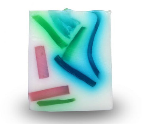 Square smooth glycerin soap bar, milky white background with green, pink and blue swirls. Fresh ocean scent. 